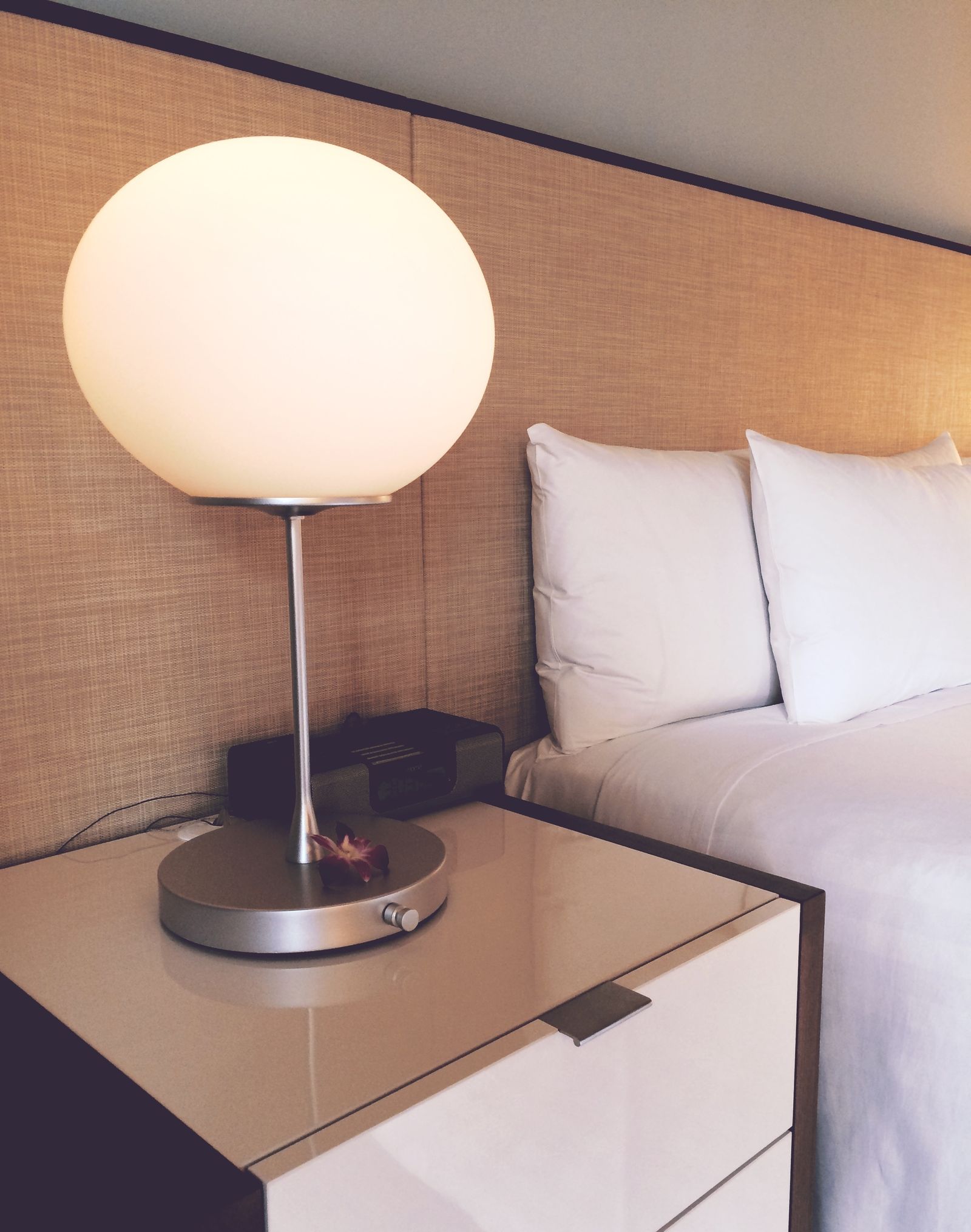 Classic hotel bedroom with linen headboard